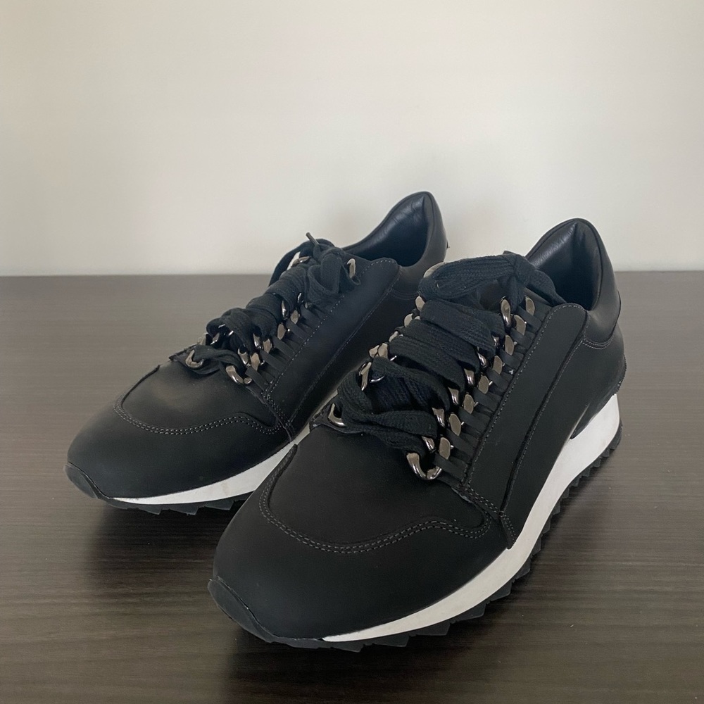 Casadei "Running Donna" Black Sneakers with Chain Design.